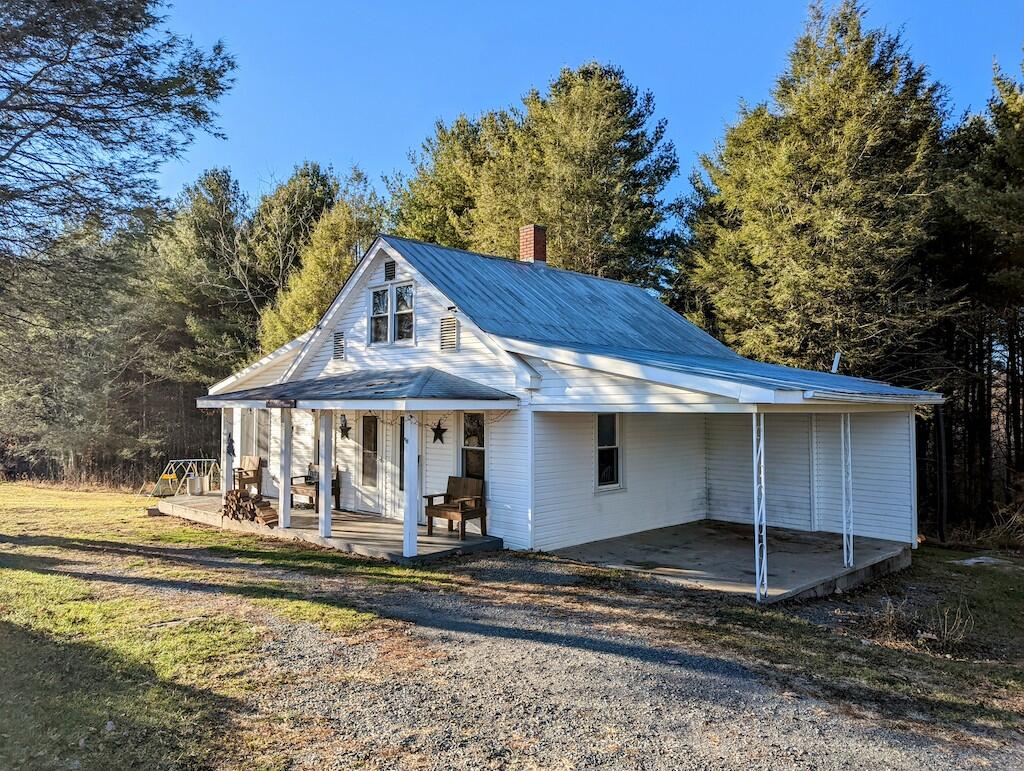 825 Macks Mountain Road Northwest Indian Valley, VA 24105 - Photo 2 of 30 a front view of a house with a yard