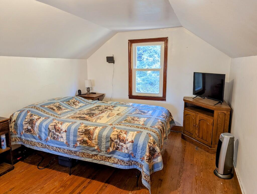 825 Macks Mountain Road Northwest Indian Valley, VA 24105 - Photo 21 of 30 a bed sitting in a bedroom next to a window