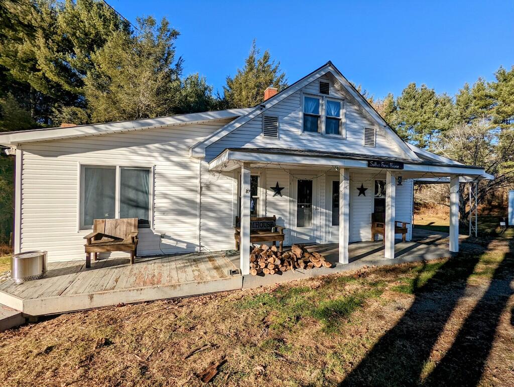 825 Macks Mountain Road Northwest Indian Valley, VA 24105 - Photo 4 of 30 a front view of a house with garden