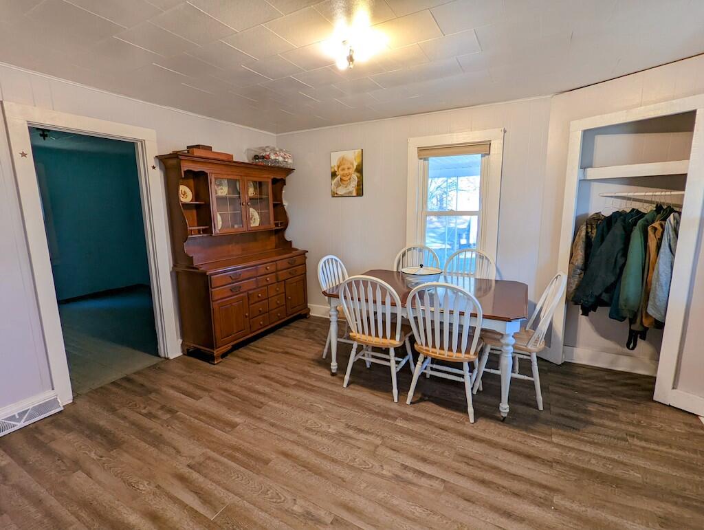 825 Macks Mountain Road Northwest Indian Valley, VA 24105 - Photo 6 of 30 a dining room with furniture and wooden floor