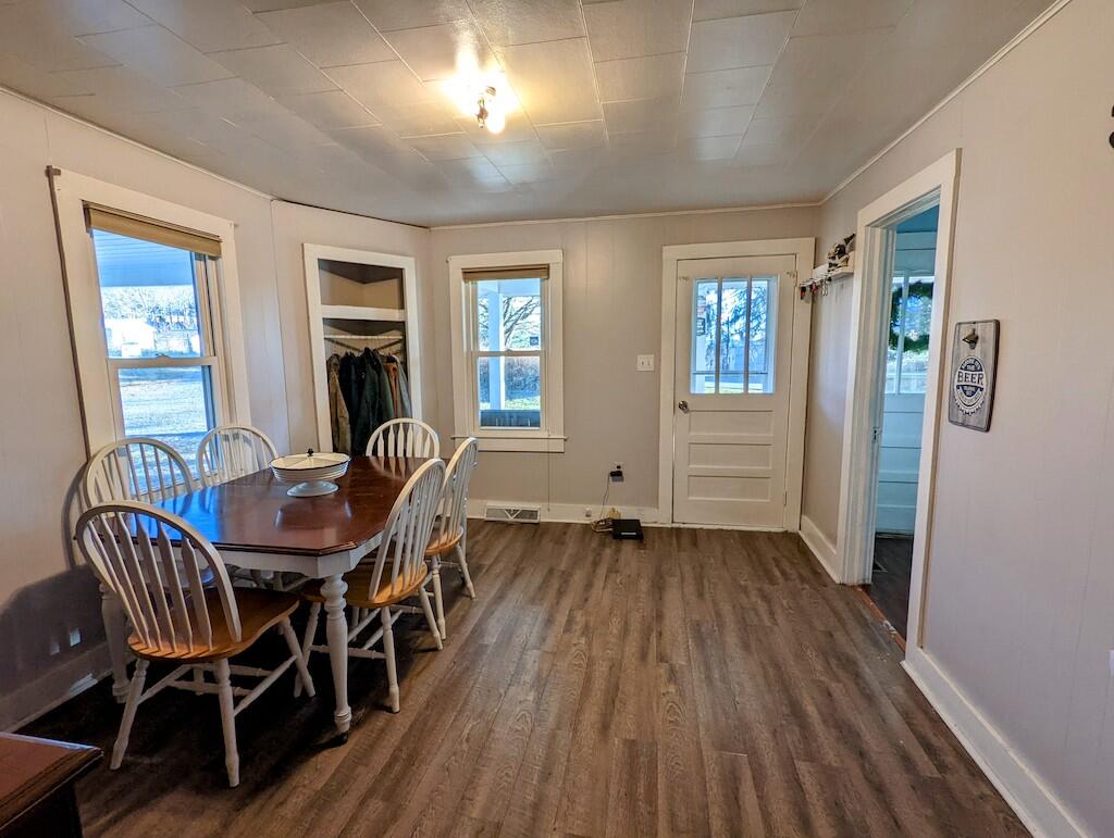 825 Macks Mountain Road Northwest Indian Valley, VA 24105 - Photo 7 of 30 a view of a dining room with furniture and wooden floor