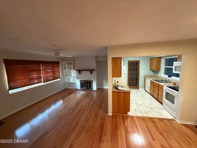 a view of kitchen with cabinets and wooden floor