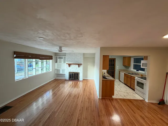a kitchen with stainless steel appliances granite countertop a stove and a sink