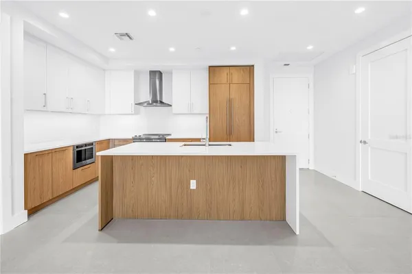 a bathroom with a shower and a glass door