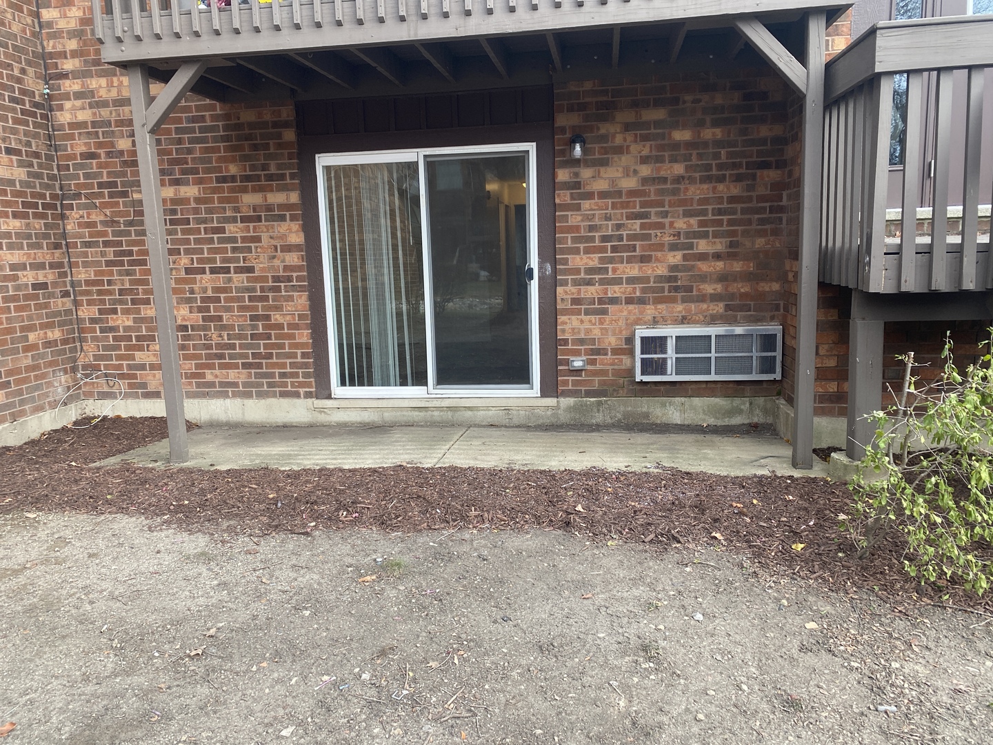 29-w542 Country Ridge Drive, Unit A Warrenville, IL 60555 - Photo 10 of 12 a front view of a house with a yard