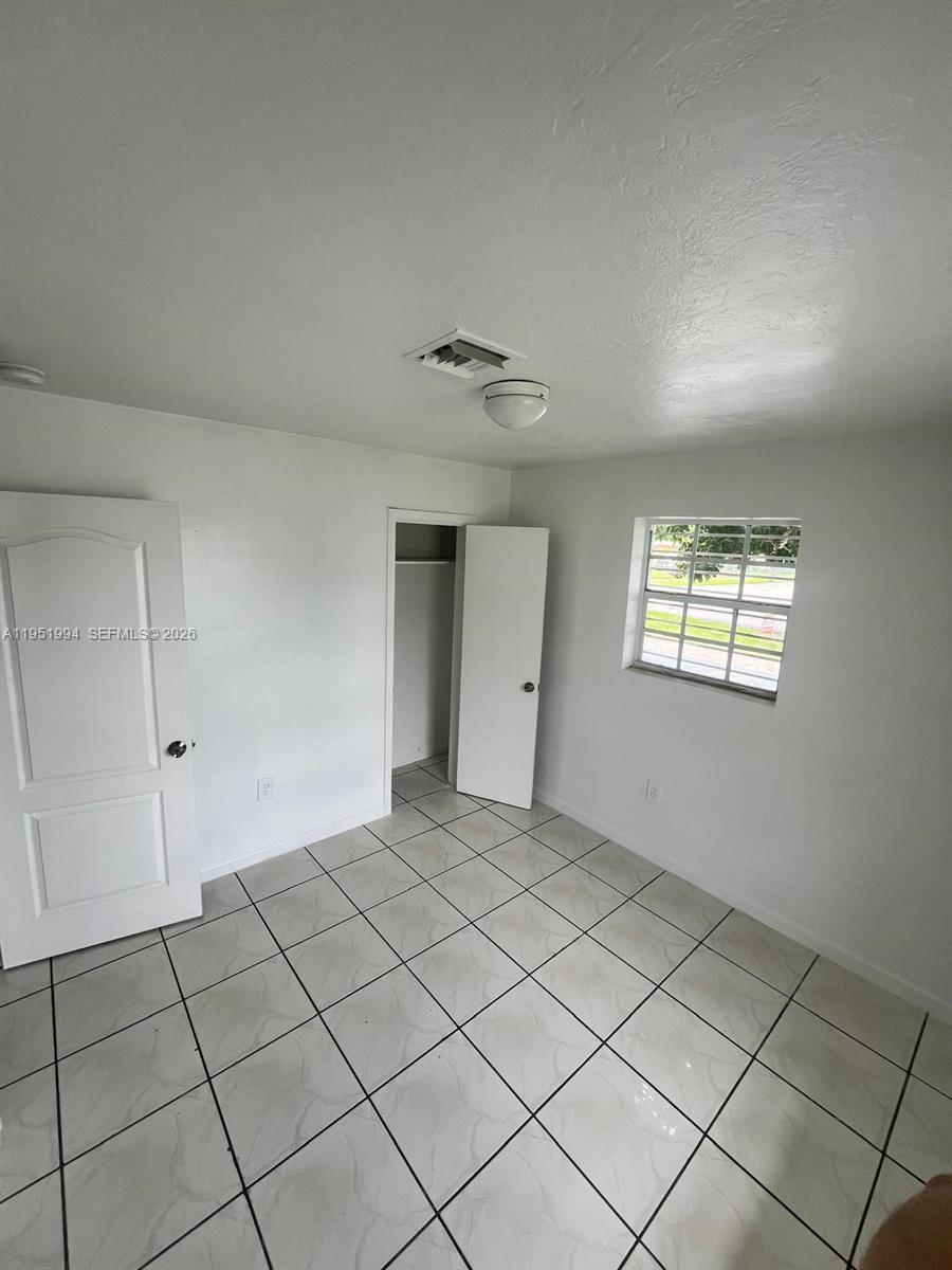 11535 Southwest 224th Street, Unit 2 Miami, FL 33170 - Photo 12 of 22 a view of an empty room and window