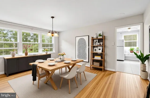 a view of a room with wooden floor and chandelier