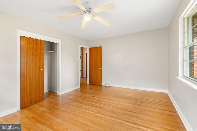 a view of an empty room with a window