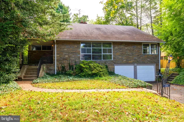 a view of house with yard and sitting space
