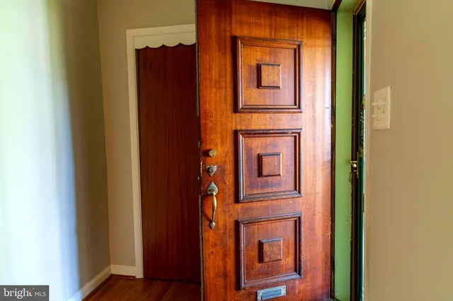 a view of hallway with wooden floor