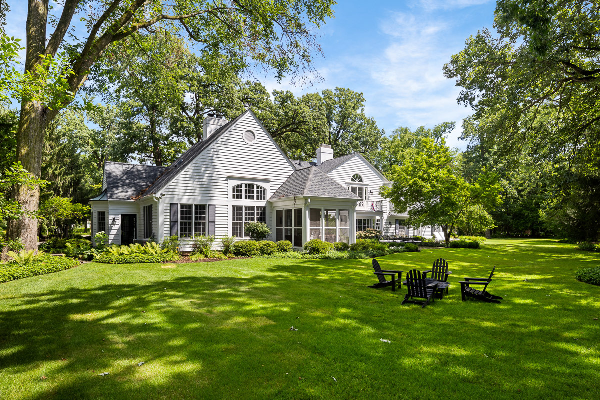 72 Woodley Road Winnetka, IL 60093 - Photo 2 of 9 a front view of a house with garden