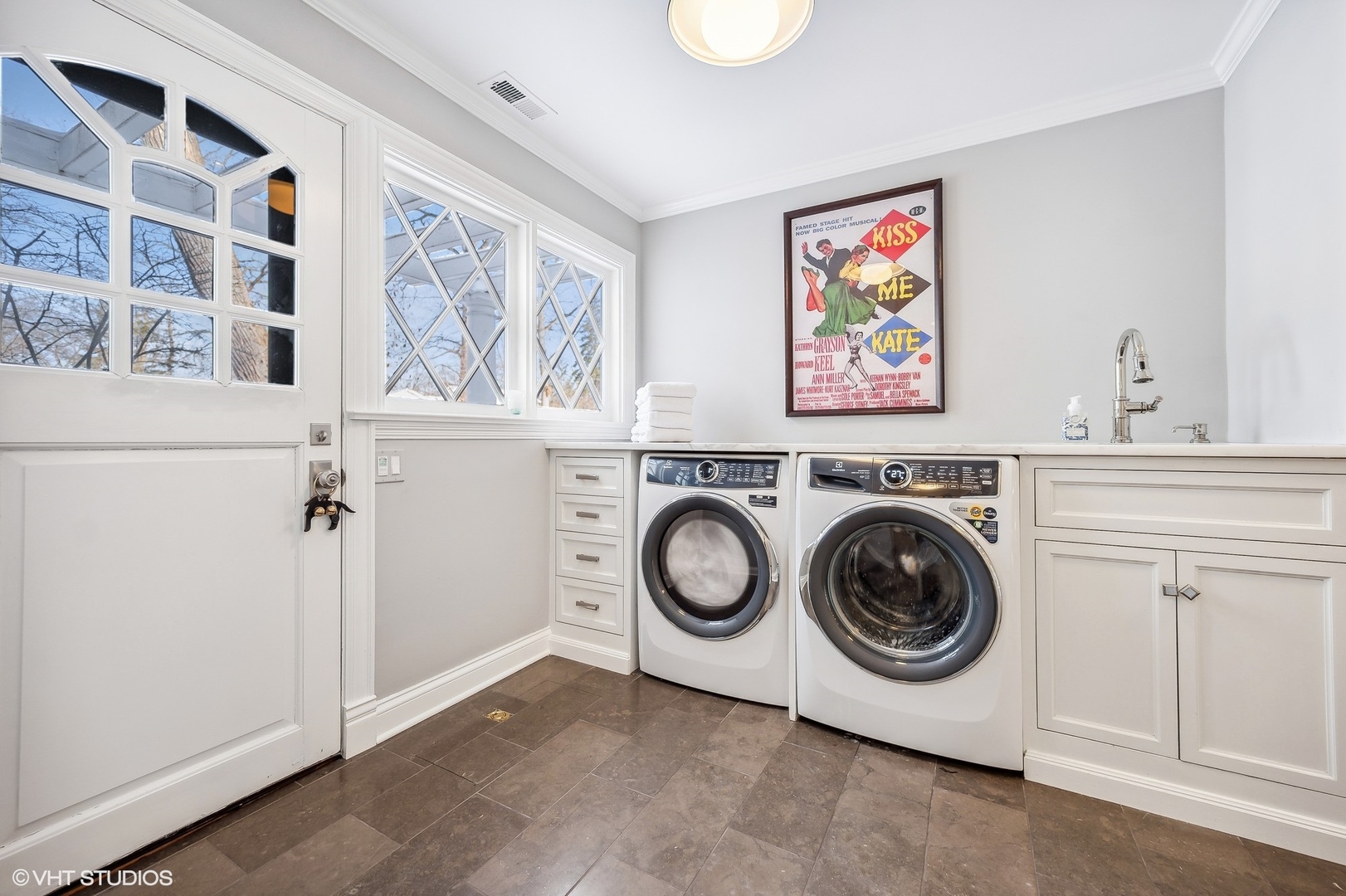 72 Woodley Road Winnetka, IL 60093 - Photo 32 of 65 a view of a storage & utility room with washer and dryer