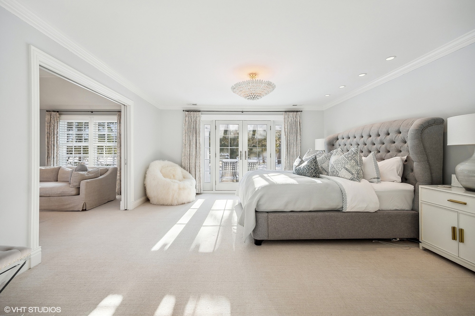 72 Woodley Road Winnetka, IL 60093 - Photo 36 of 65 a spacious bedroom with a bed and glass window