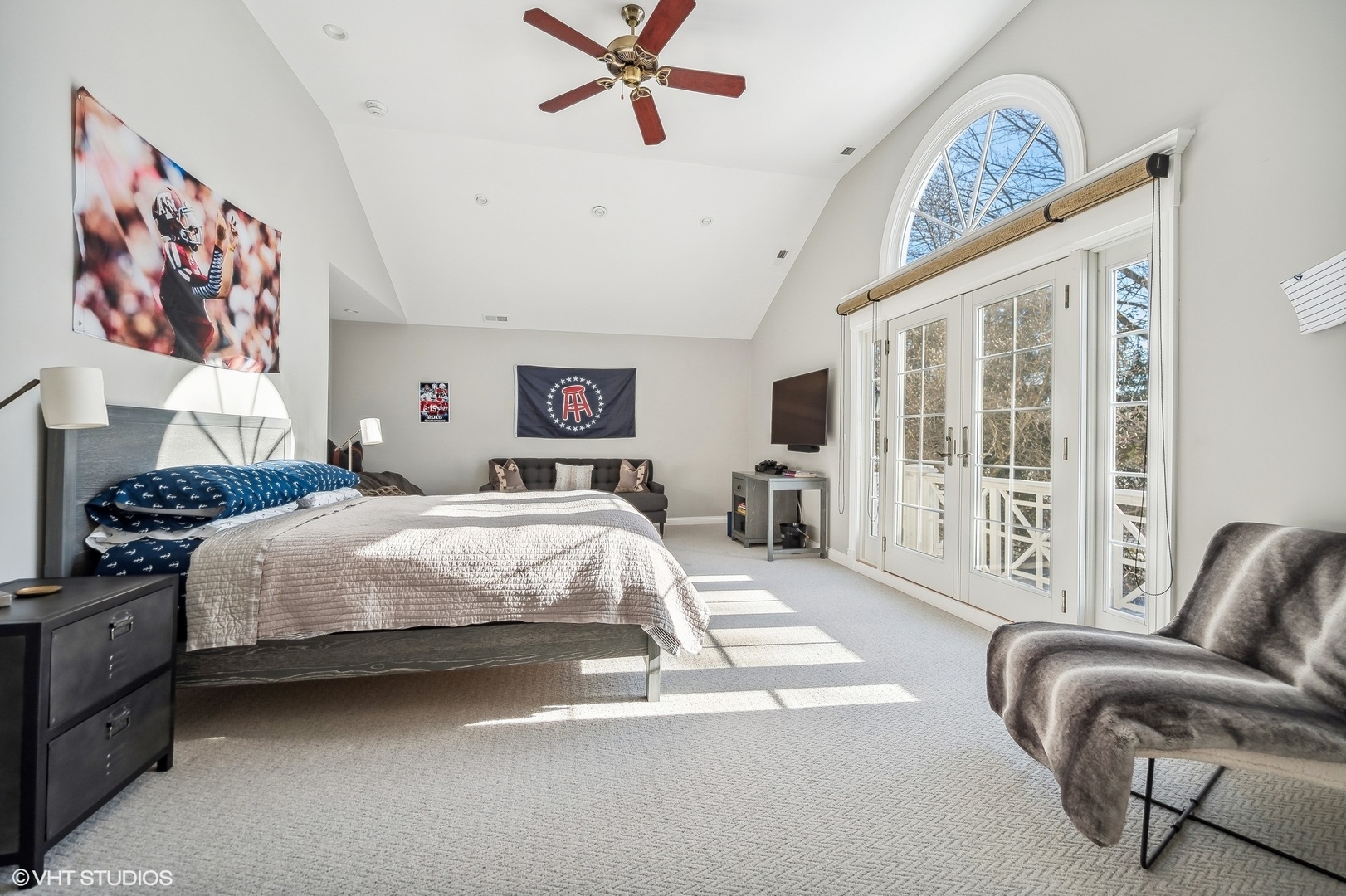 72 Woodley Road Winnetka, IL 60093 - Photo 49 of 65 a bedroom with a bed couch and a large window