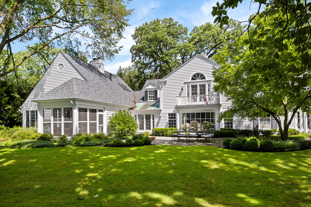 72 Woodley Road Winnetka, IL 60093 - Photo 5 of 9 a front view of a house with a yard