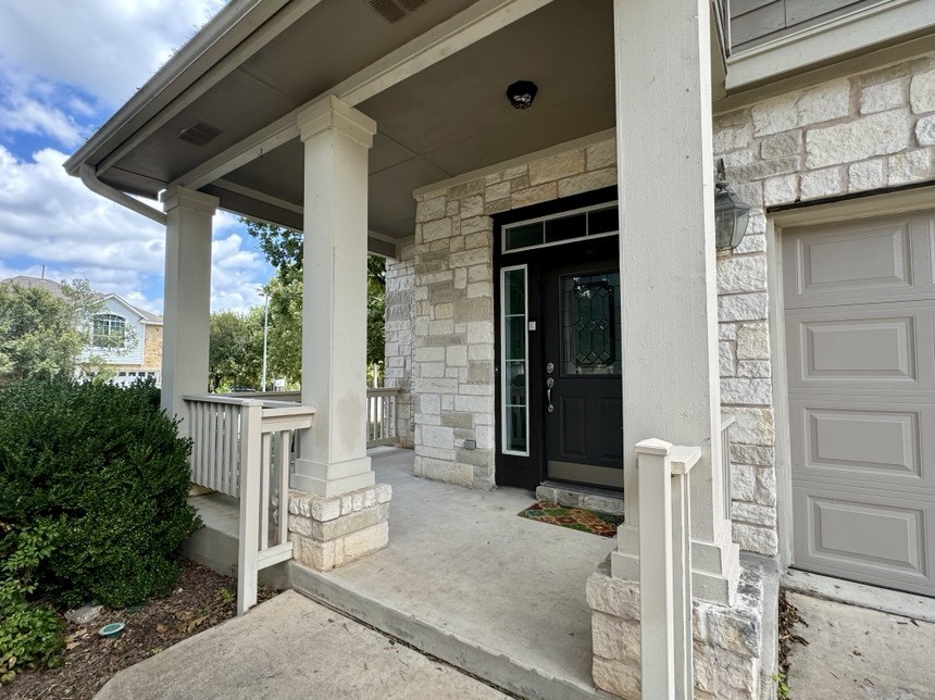8301 Winterstein Drive Austin, TX 78745 - Photo 2 of 25 a view of a porch with a door and a fireplace