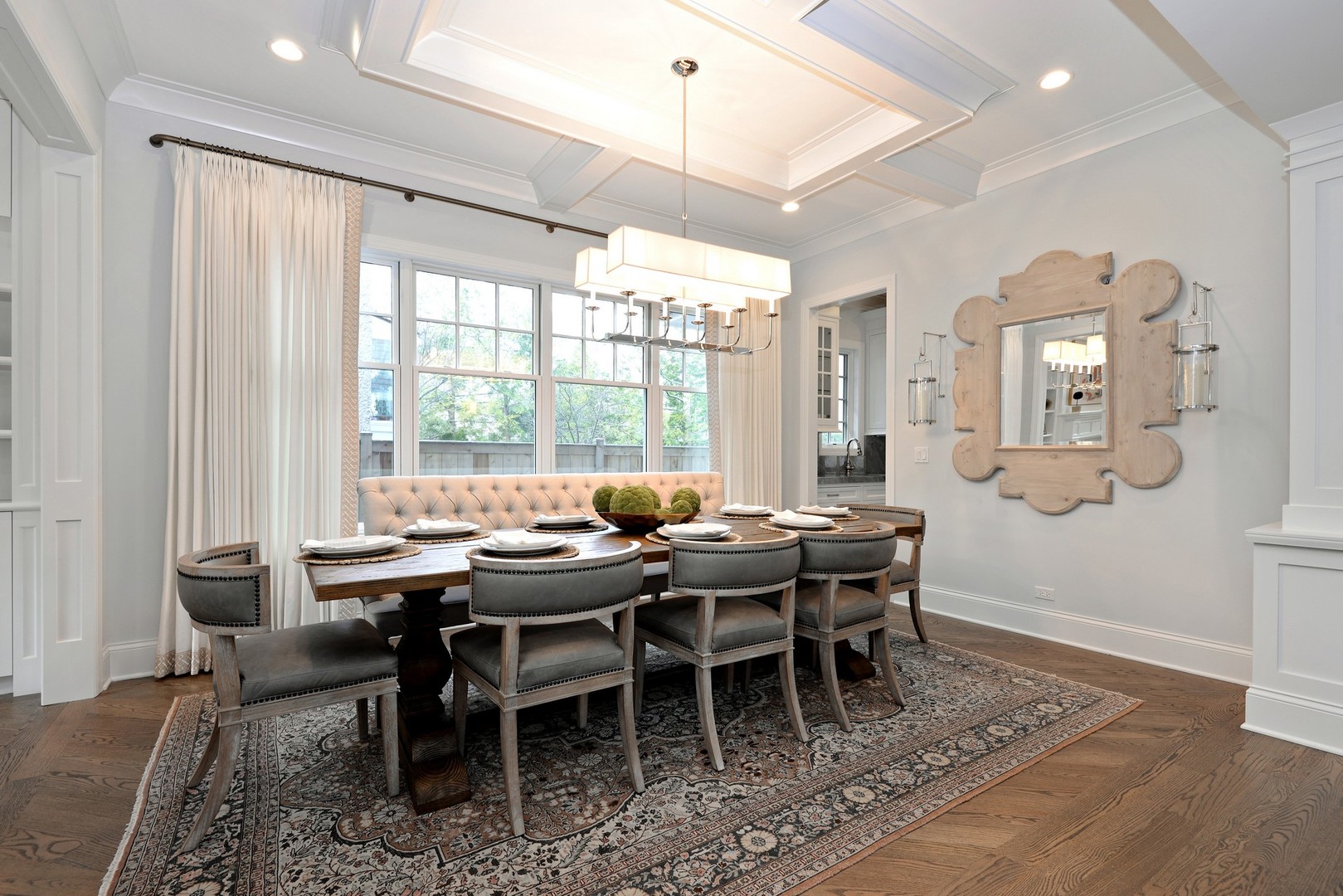 1003 Westmoor Road Winnetka, IL 60093 - Photo 11 of 38 a dining room with wooden floor a chandelier a wooden table and chairs