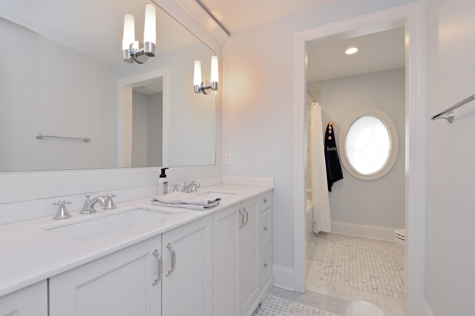 1003 Westmoor Road Winnetka, IL 60093 - Photo 22 of 38 a spacious bathroom with a sink mirror and vanity