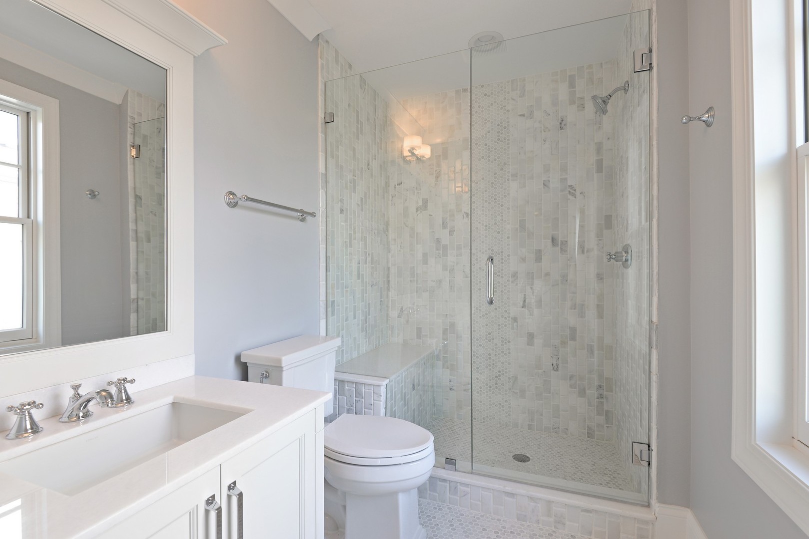 1003 Westmoor Road Winnetka, IL 60093 - Photo 24 of 38 a bathroom with a shower sink vanity and toilet