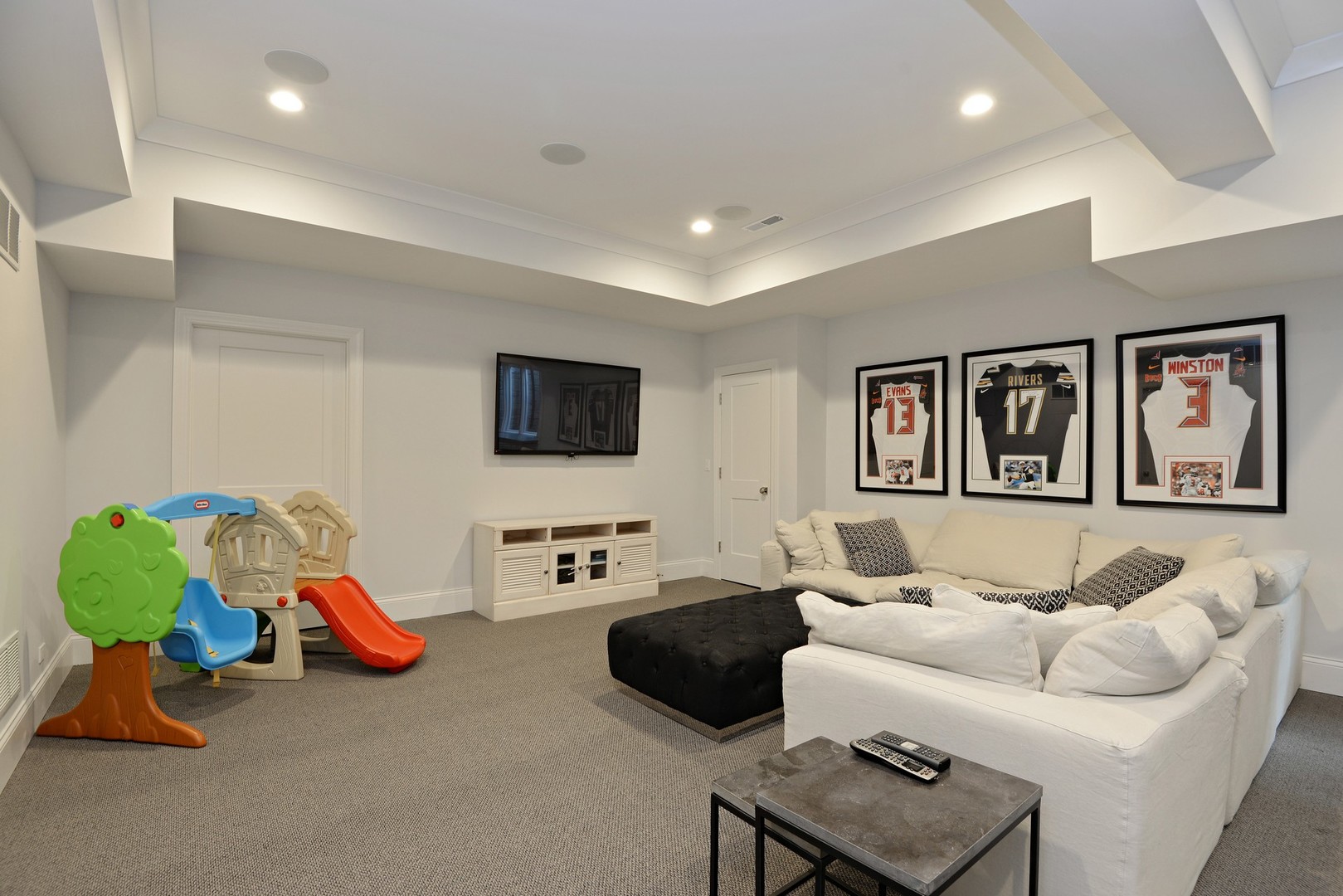 1003 Westmoor Road Winnetka, IL 60093 - Photo 29 of 38 a living room with furniture and a flat screen tv