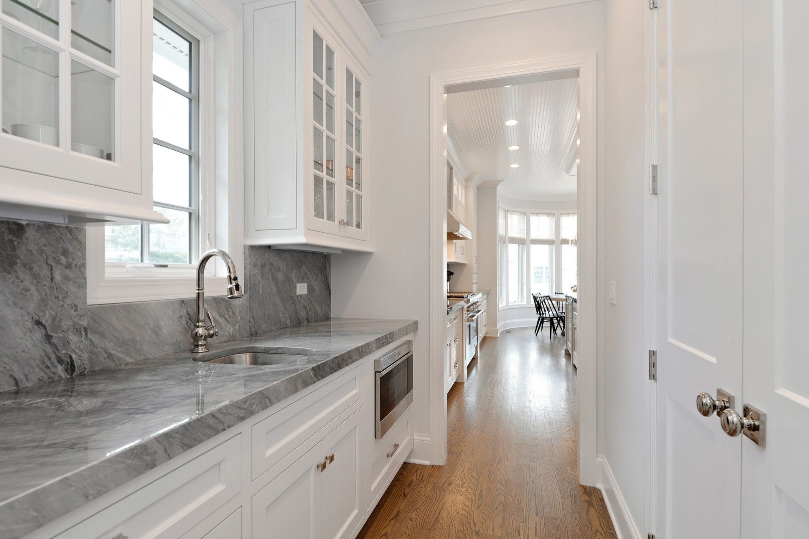 1003 Westmoor Road Winnetka, IL 60093 - Photo 7 of 38 a kitchen with sink and cabinets