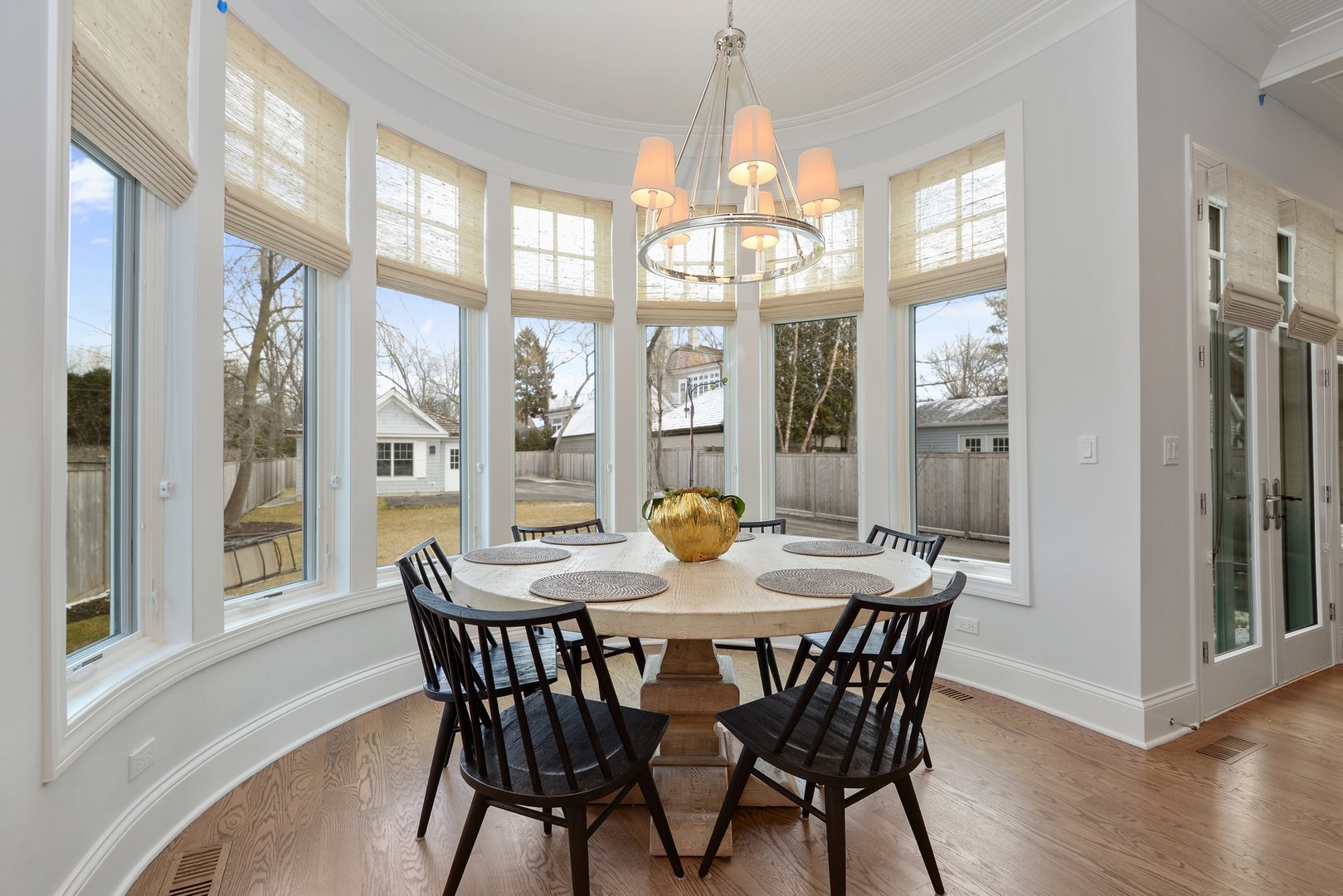1003 Westmoor Road Winnetka, IL 60093 - Photo 9 of 38 a view of a dining room with furniture a chandelier and wooden floor