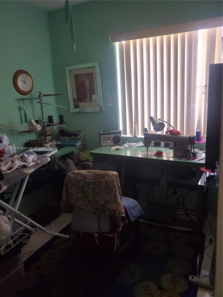 10953 West Okeechobee Road, Unit 101 Hialeah Gardens, FL 33018 - Photo 14 of 15 a bathroom with a sink and a mirror