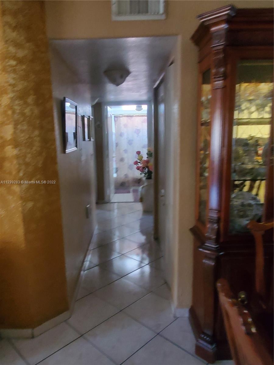 10953 West Okeechobee Road, Unit 101 Hialeah Gardens, FL 33018 - Photo 15 of 15 a view of entryway