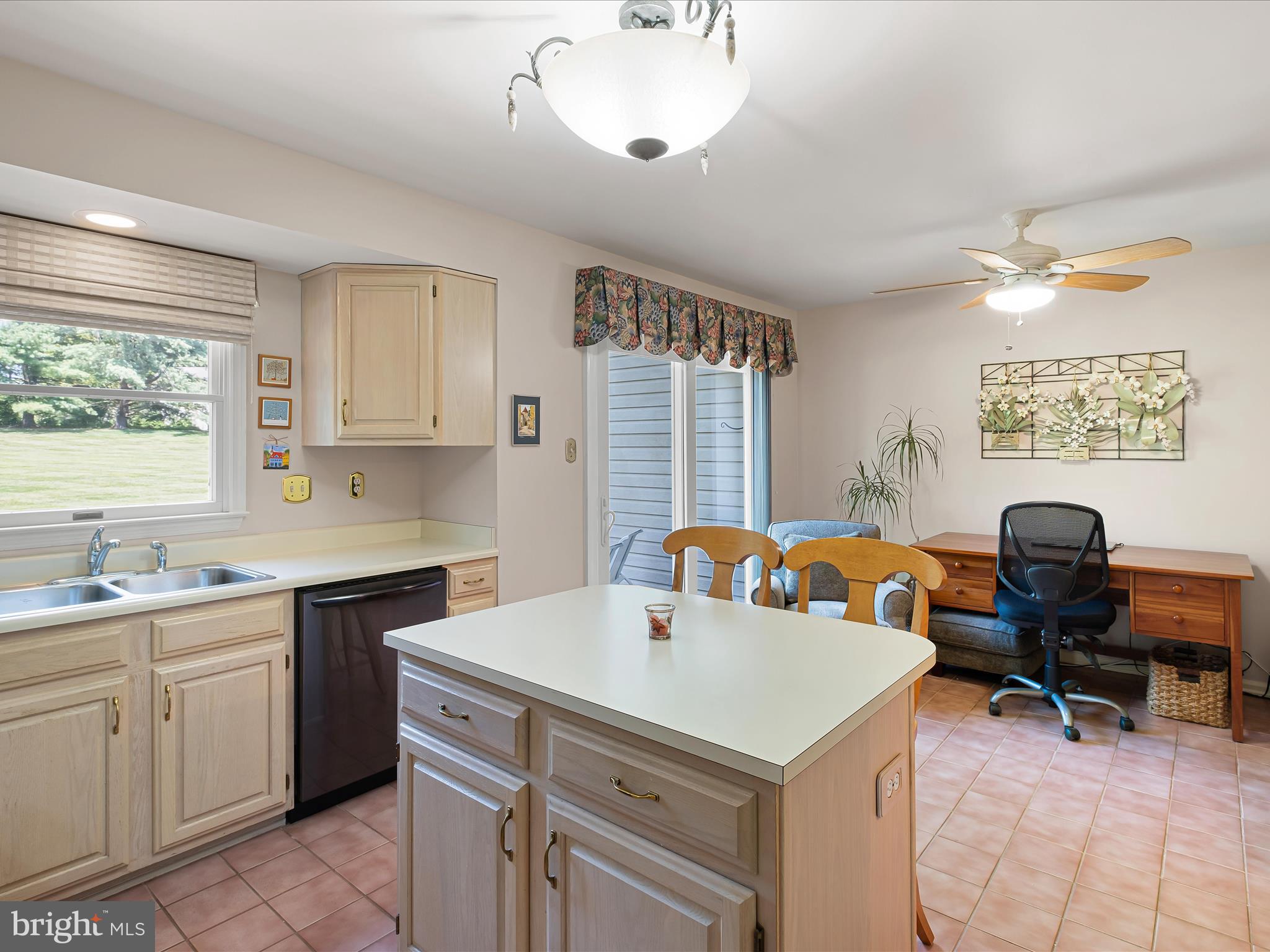 314 Edinburgh Road Chadds Ford, PA 19317 - Photo 16 of 29 a view of a kitchen with a sink dishwasher a dining table and chairs with wooden floor