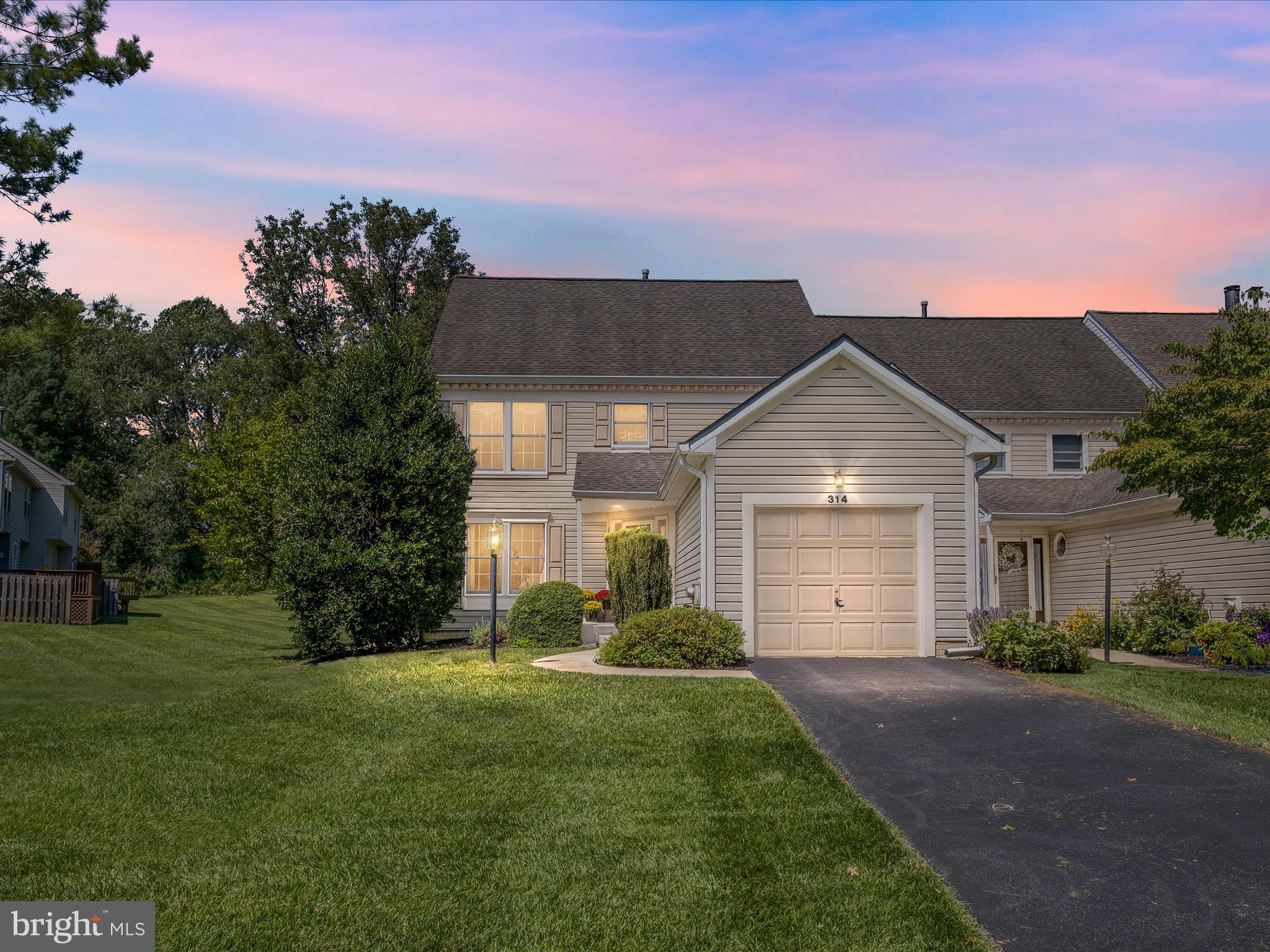 314 Edinburgh Road Chadds Ford, PA 19317 - Photo 4 of 29 a front view of a house with a yard and garage