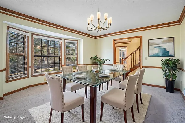a view of a dining room with furniture window and outside view