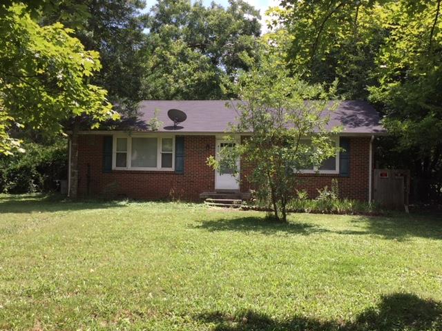 4129 Sulphur Springs Road Murfreesboro, TN 37129 - Photo 11 of 11 a backyard of a house with yard and outdoor seating