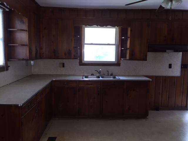 4129 Sulphur Springs Road Murfreesboro, TN 37129 - Photo 4 of 11 a kitchen with a sink a window and cabinets