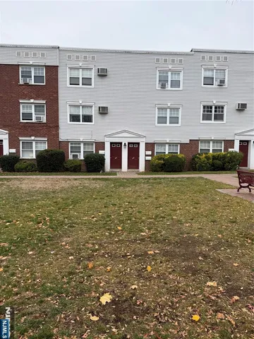 a view of a building with a yard