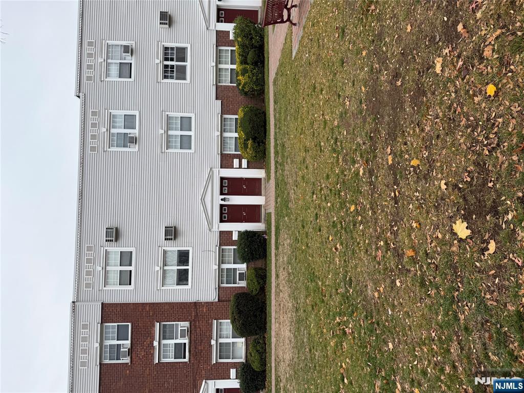 a view of a building with a yard