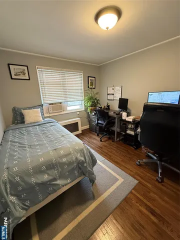 a bedroom with a bed and chair