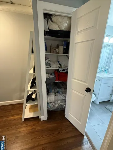 a view of entryway with wooden floor and closet