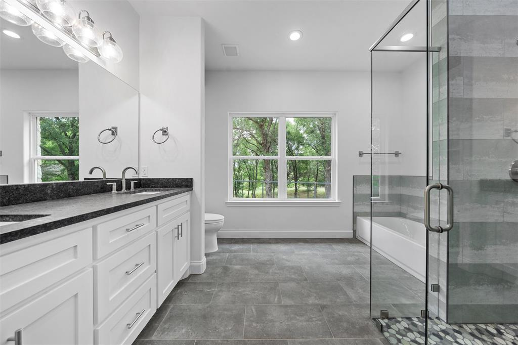1698 Rogers Hill Road Waco, TX 76705 - Photo 16 of 40 Bathroom with plenty of natural light, double vanity, baseboards, toilet, and recessed lighting