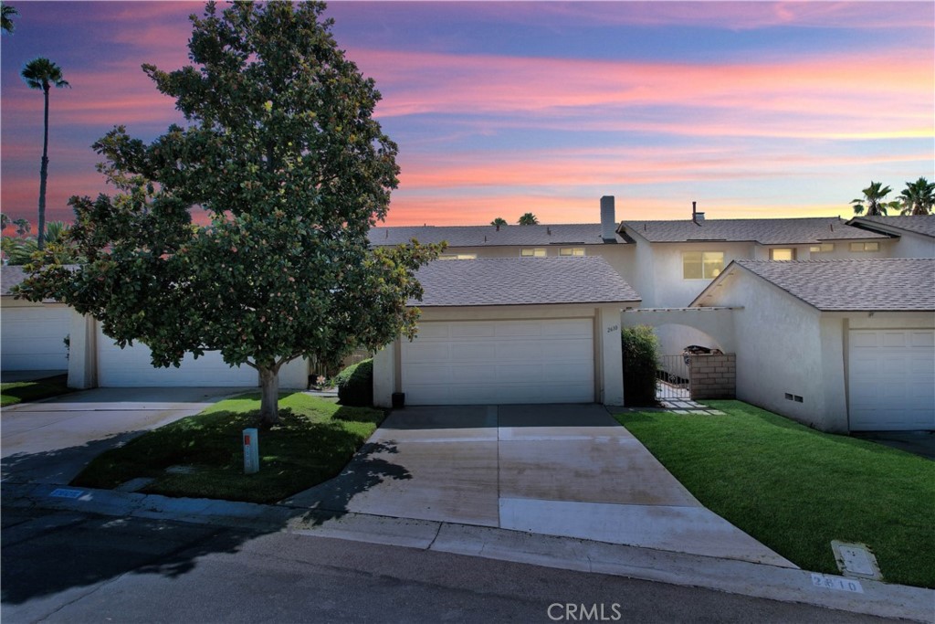 2610 Mangrove Way Riverside, CA 92506 - Photo 1 of 1 a front view of a house with a yard and garage