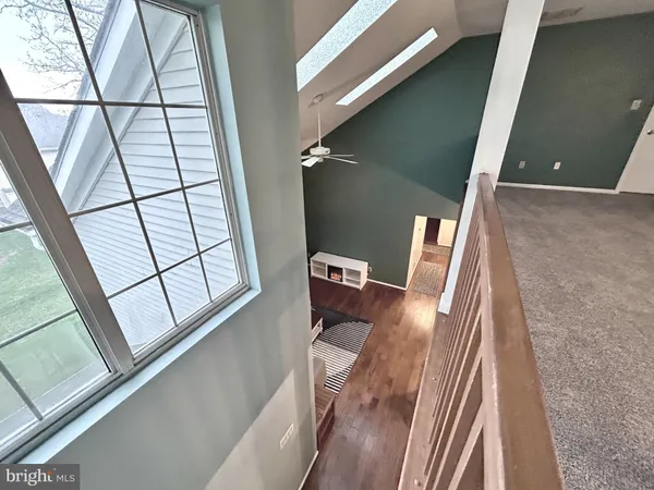 a view of walk in closet with clothes