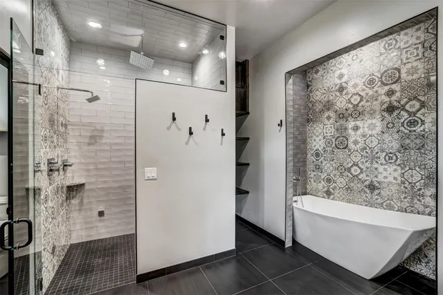 a bathroom with a bathtub and shower