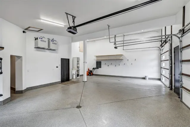a view of a livingroom with stairs and a ceiling fan