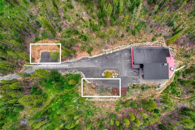 aerial view of a house with a yard