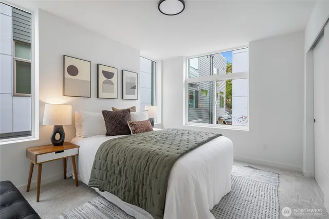 a bedroom with a bed and window