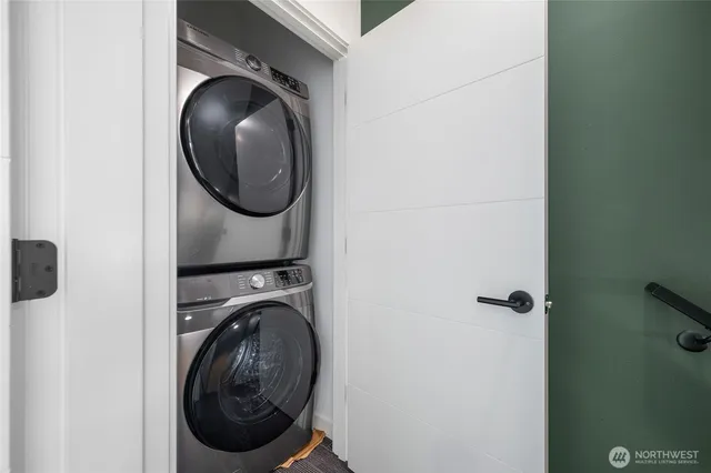 a view of a hallway with washer and dryer