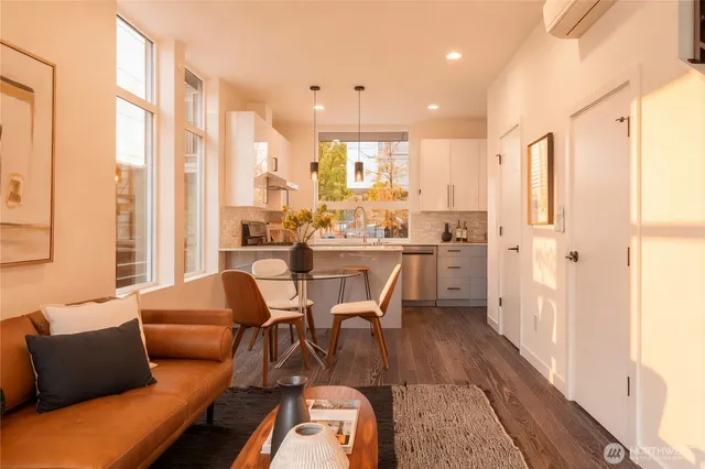a dining room with furniture and wooden floor