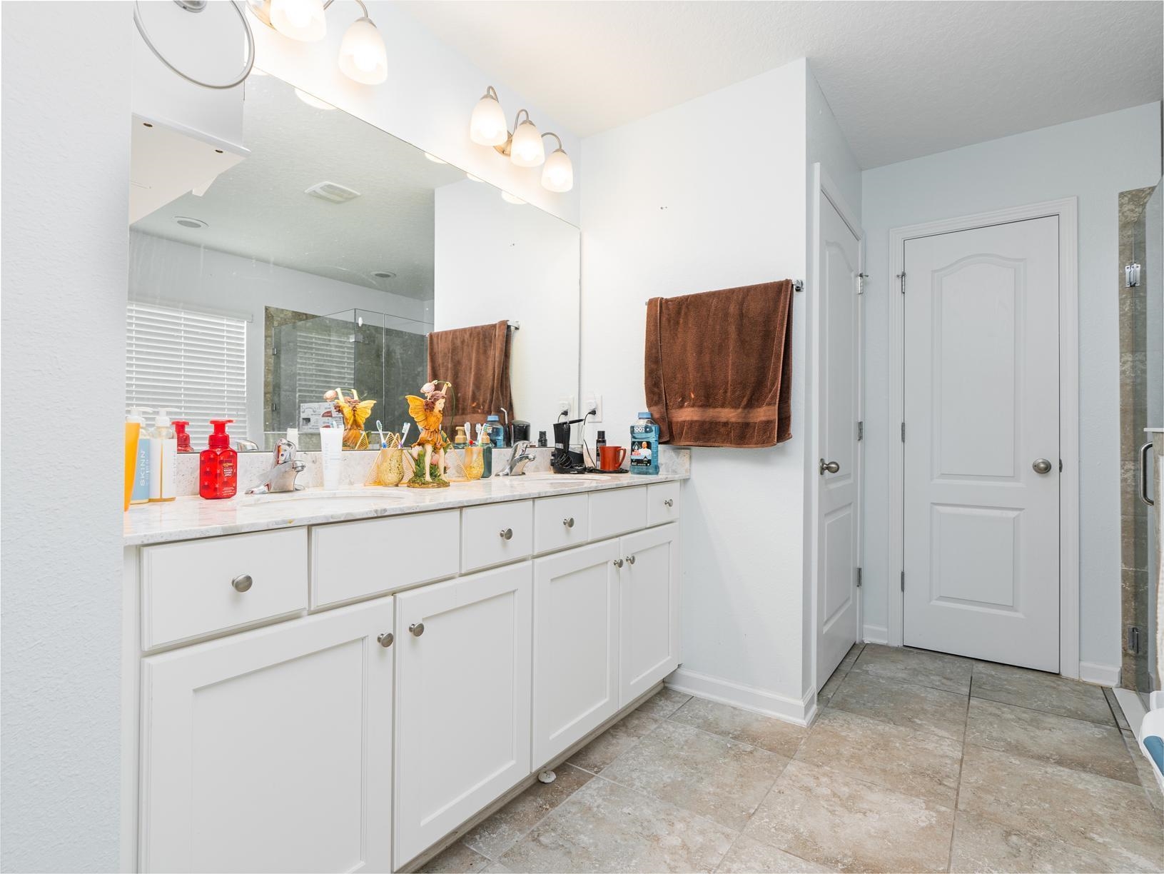 178 South Hamilton Springs Road St. Augustine, FL 32084 - Photo 12 of 26 a room with mirror and cabinets