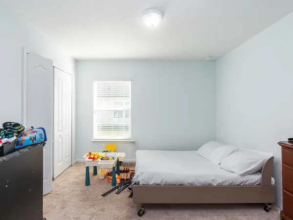 a bathroom with a sink toilet vanity and tub