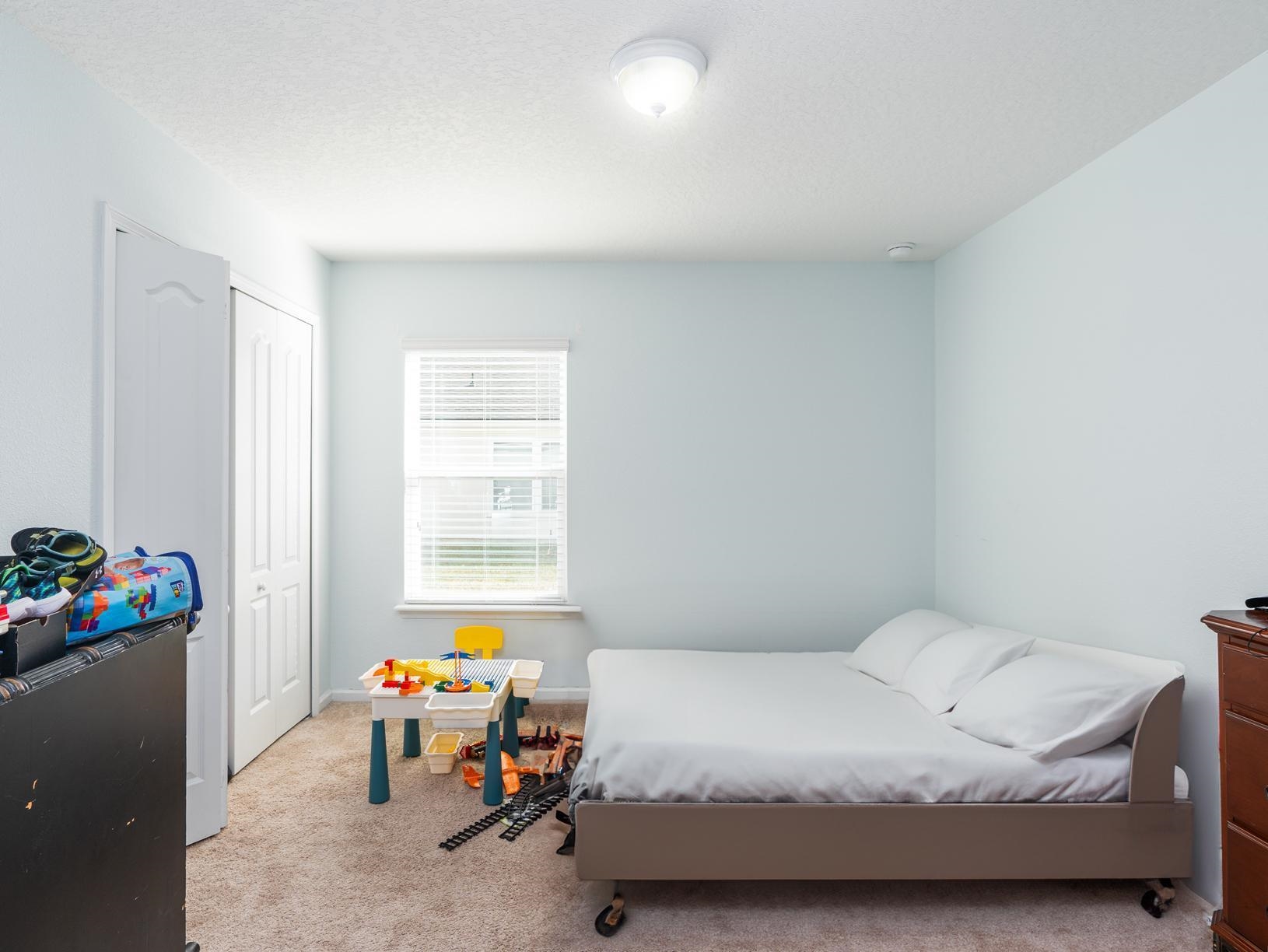 178 South Hamilton Springs Road St. Augustine, FL 32084 - Photo 15 of 26 a bedroom with a bed and a window