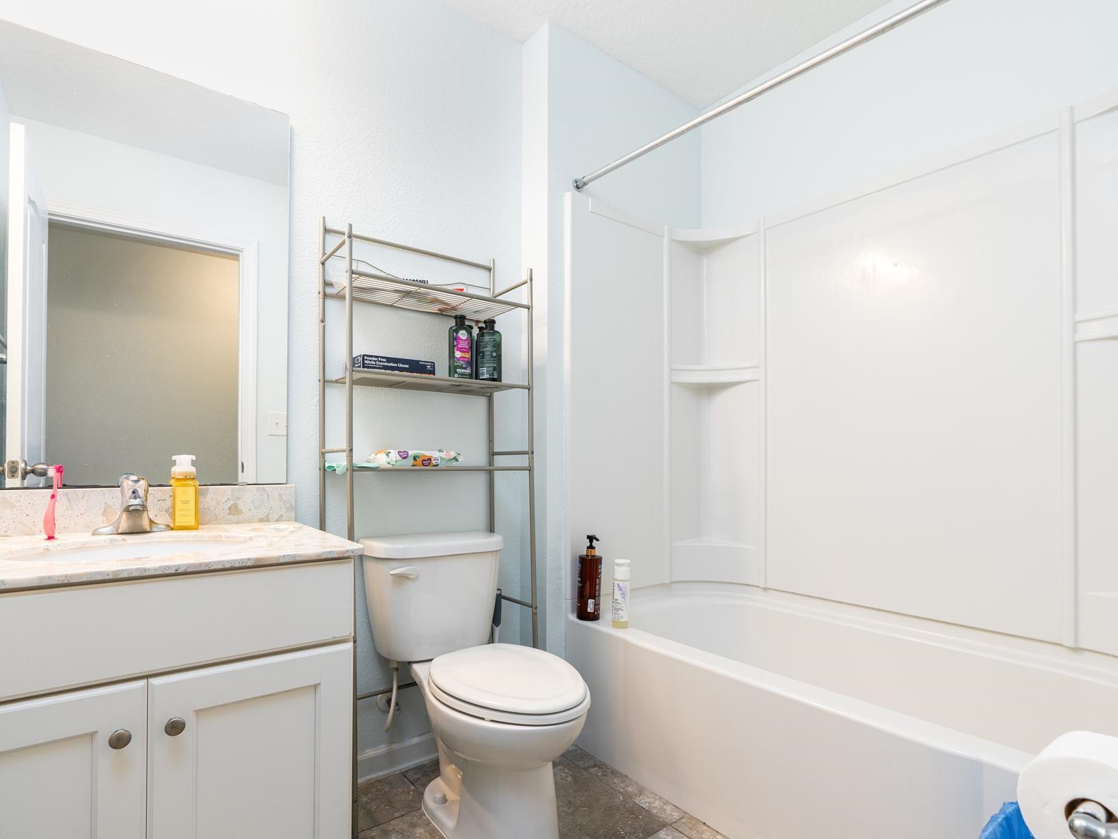 178 South Hamilton Springs Road St. Augustine, FL 32084 - Photo 16 of 26 a bathroom with a sink toilet vanity and tub